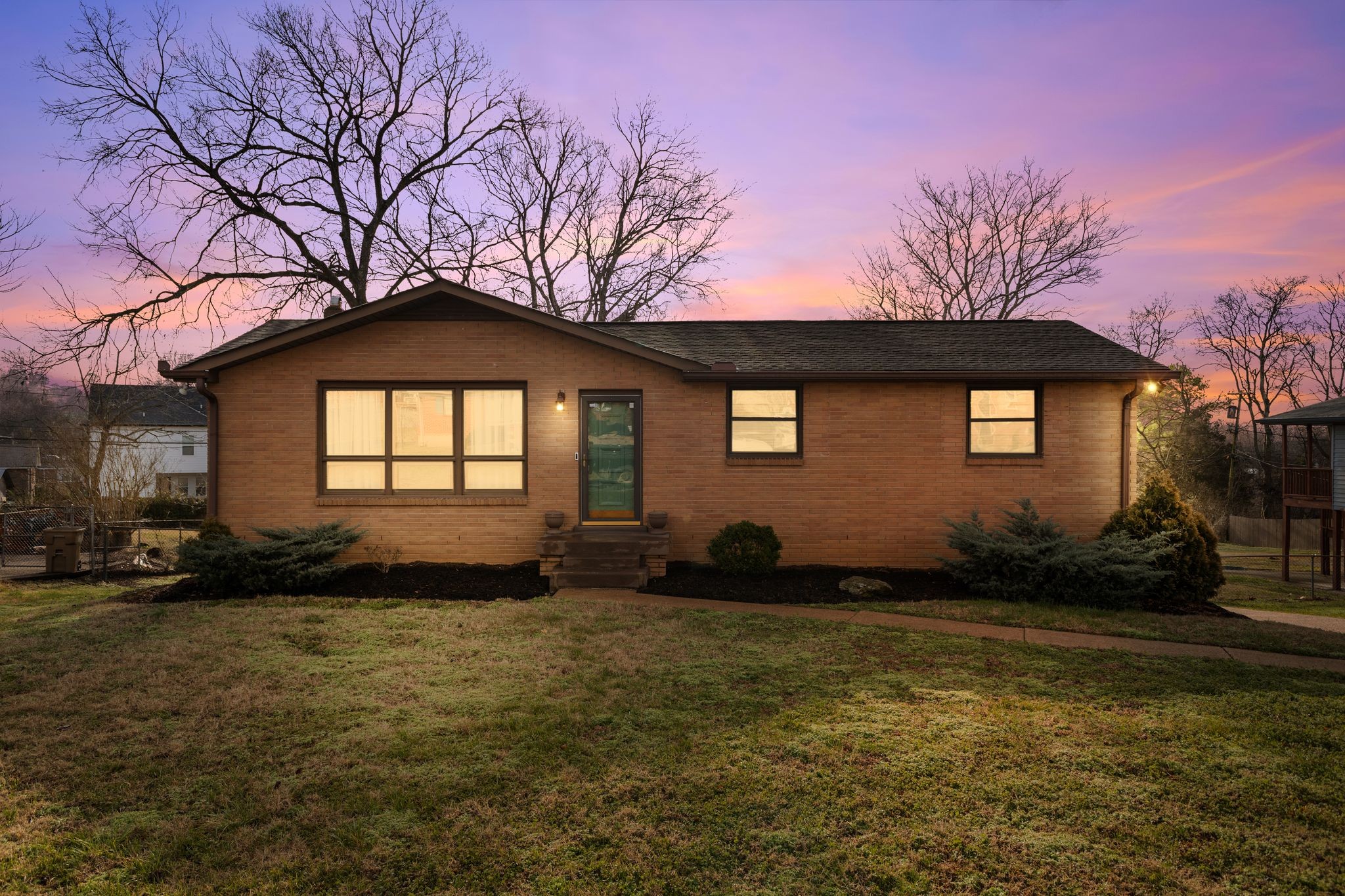 6411 Ranchero Drive Nashville, TN 37209 - Photo 3 of 34 a front view of a house with a yard