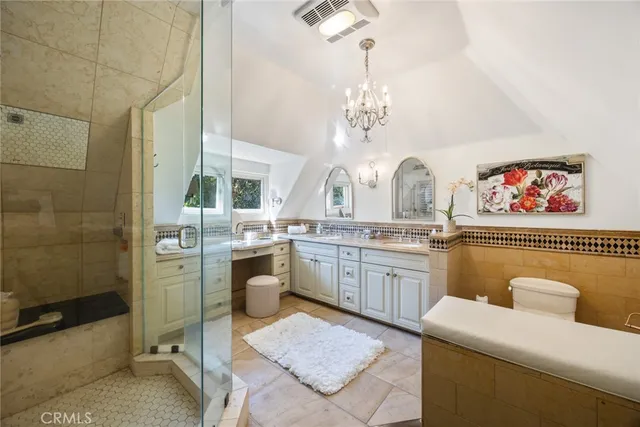 a bathroom with a sink a mirror and a shower