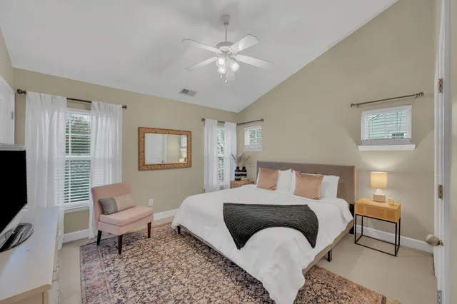 a bedroom with a bed and a chair