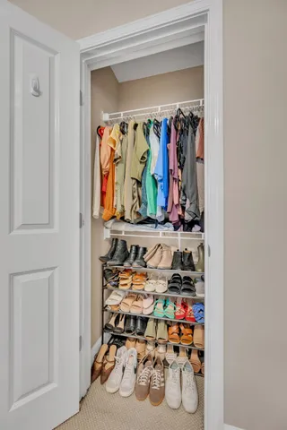 a view of a closet with storage