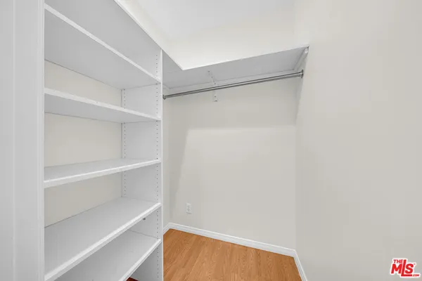 a view of an empty walk in closet