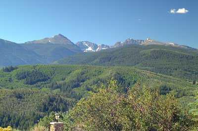 114 Alhambra Place Edwards, CO 81632 - Photo 2 of 5 a view of a lush green hillside and a building