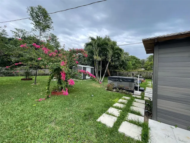 a view of a toilet and chair in the balcony