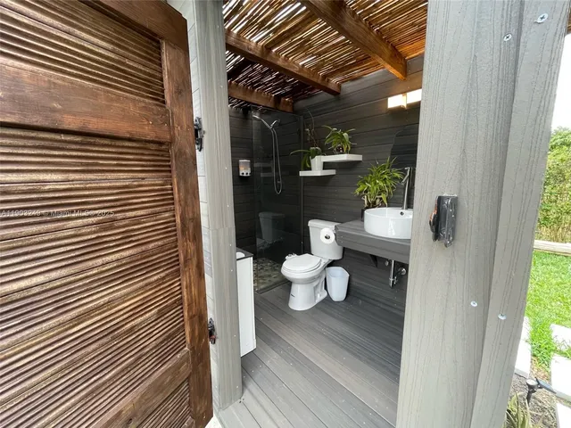 a bathroom with a toilet and a sink