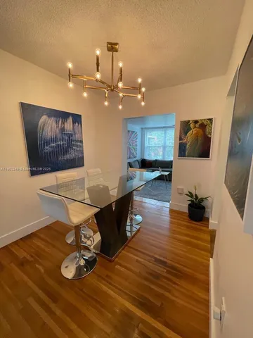 a kitchen with granite countertop a refrigerator and a stove
