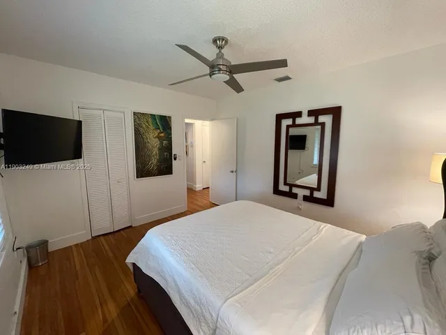 a bathroom with a shower and toilet