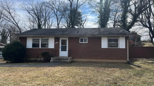 a house with trees in front of it