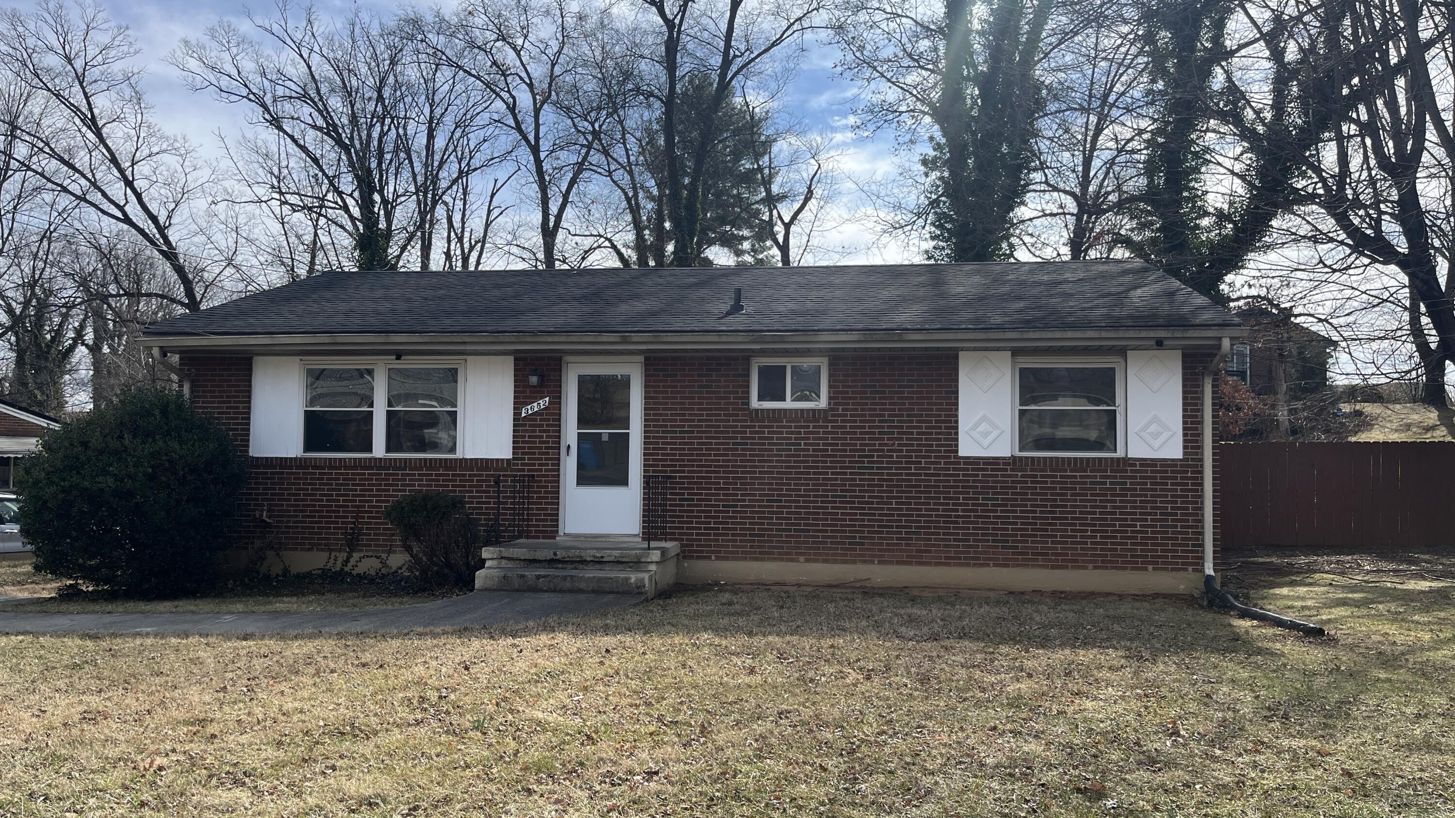 a house with trees in front of it