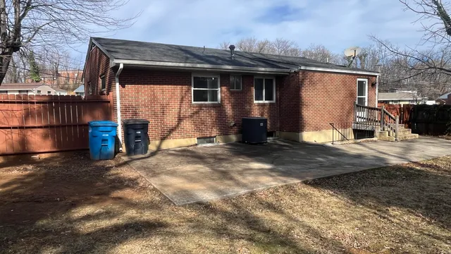 a view of house with backyard