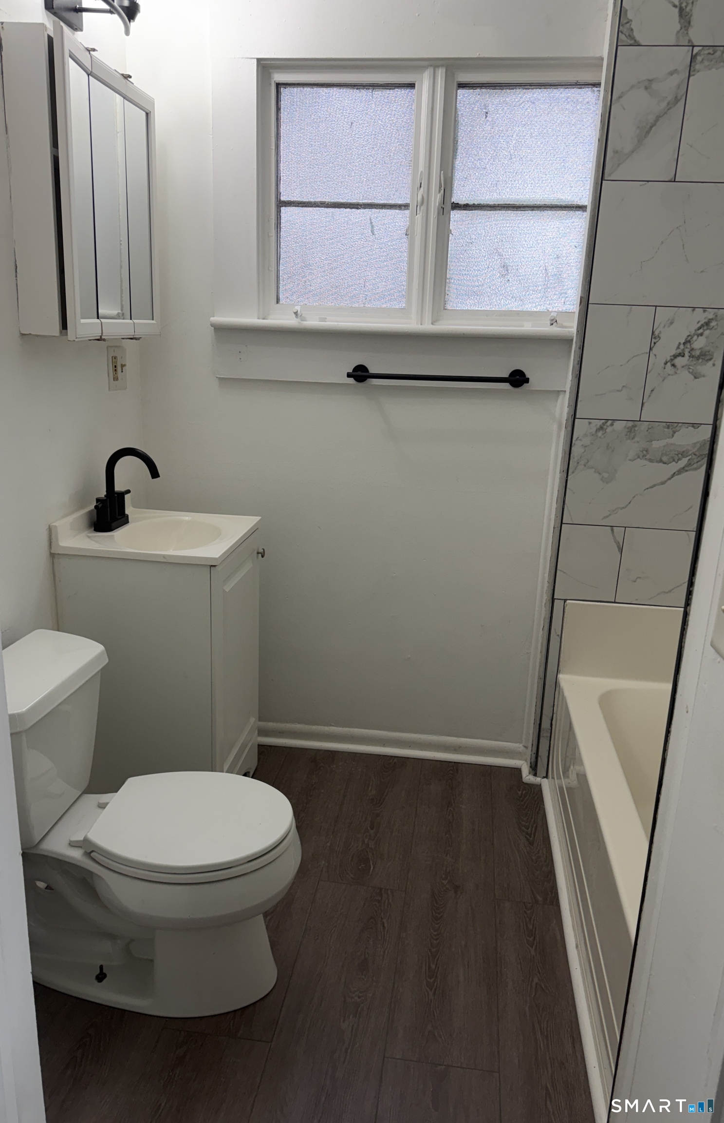 184 Hoffman Street Torrington, CT 06790 - Photo 11 of 12 a bathroom with a toilet and a sink