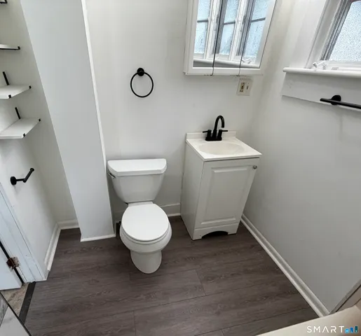 a bathroom with a toilet and a sink