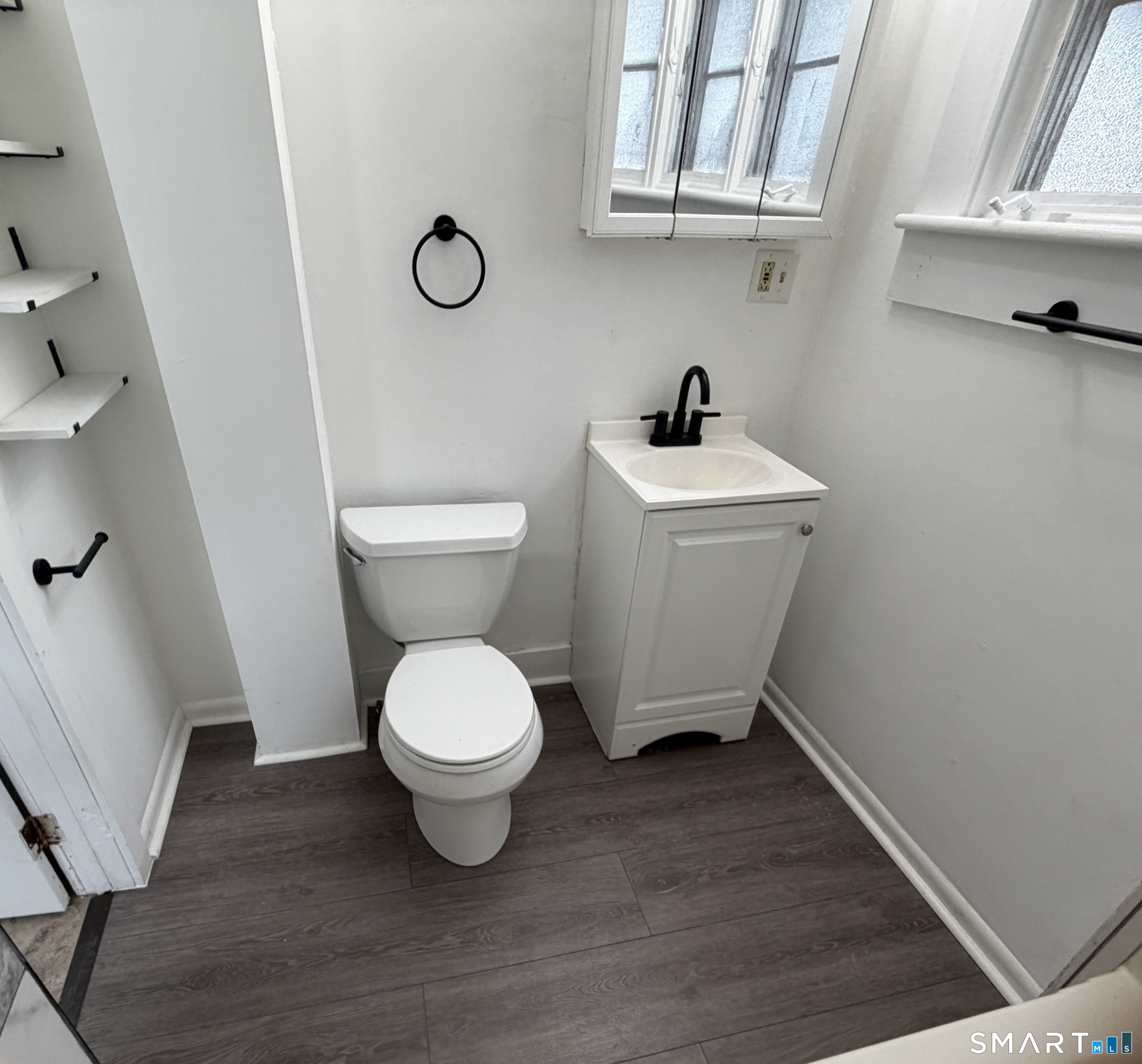 184 Hoffman Street Torrington, CT 06790 - Photo 10 of 12 a bathroom with a toilet and a sink