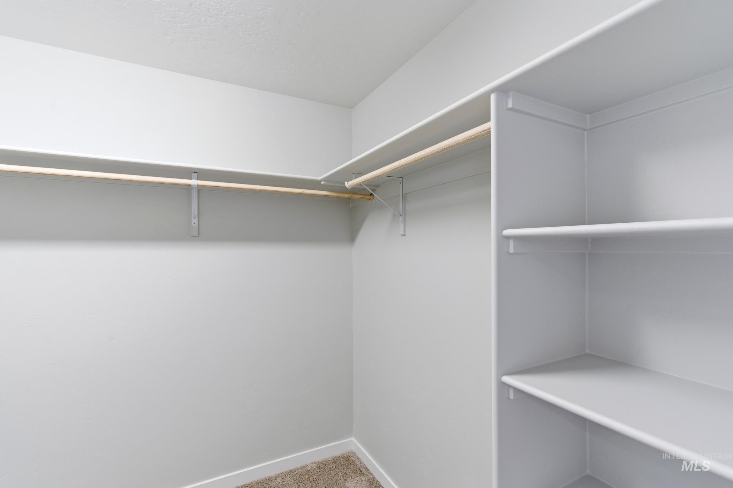 13709 Redway Court Caldwell, ID 83607 - Photo 25 of 28 Walk-in closet featuring built-in shelving and hanging rods