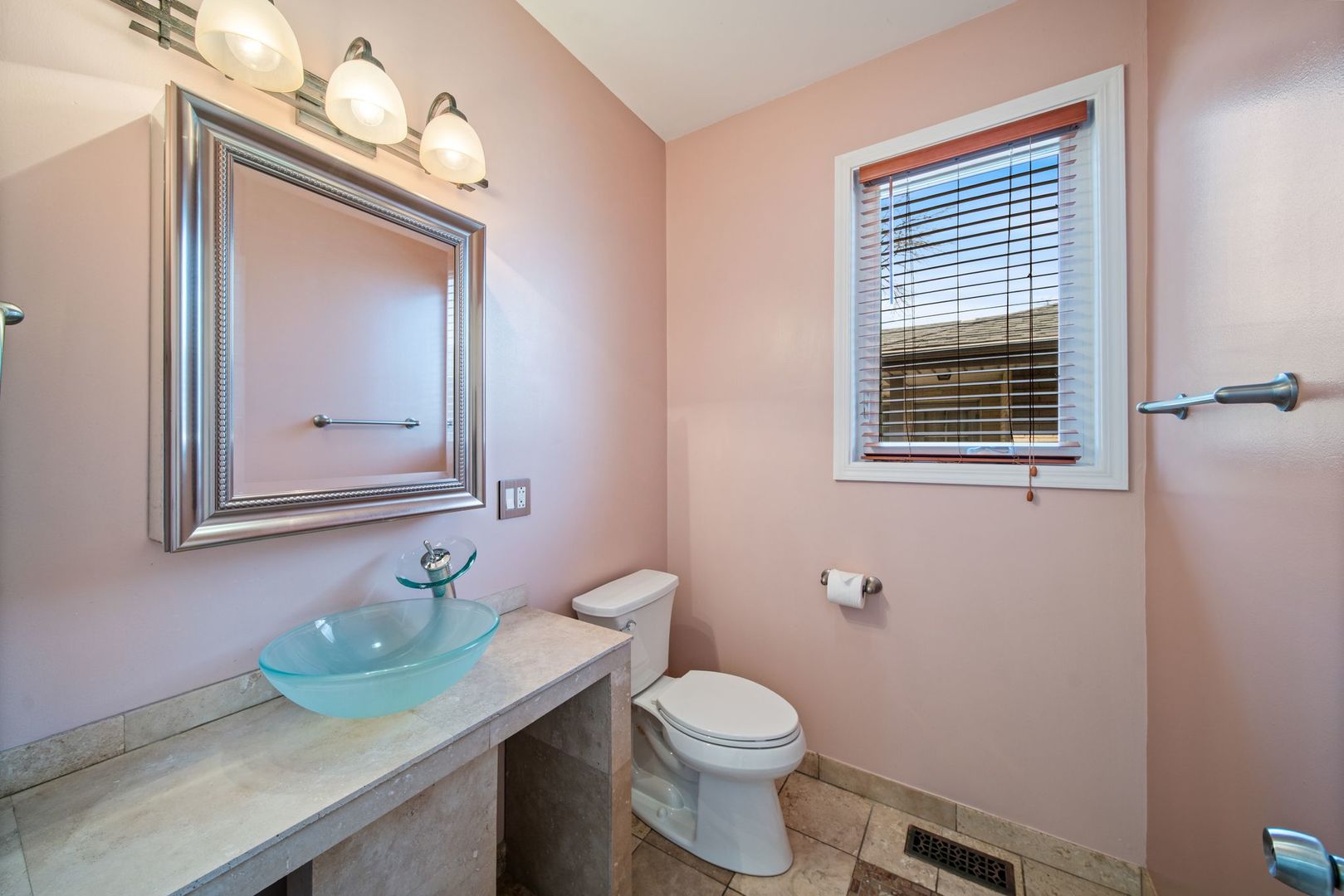 701 Oakton Street Park Ridge, IL 60068 - Photo 17 of 59 a bathroom with a toilet a sink and mirror