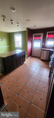 a large room with a lot of cabinets and furniture