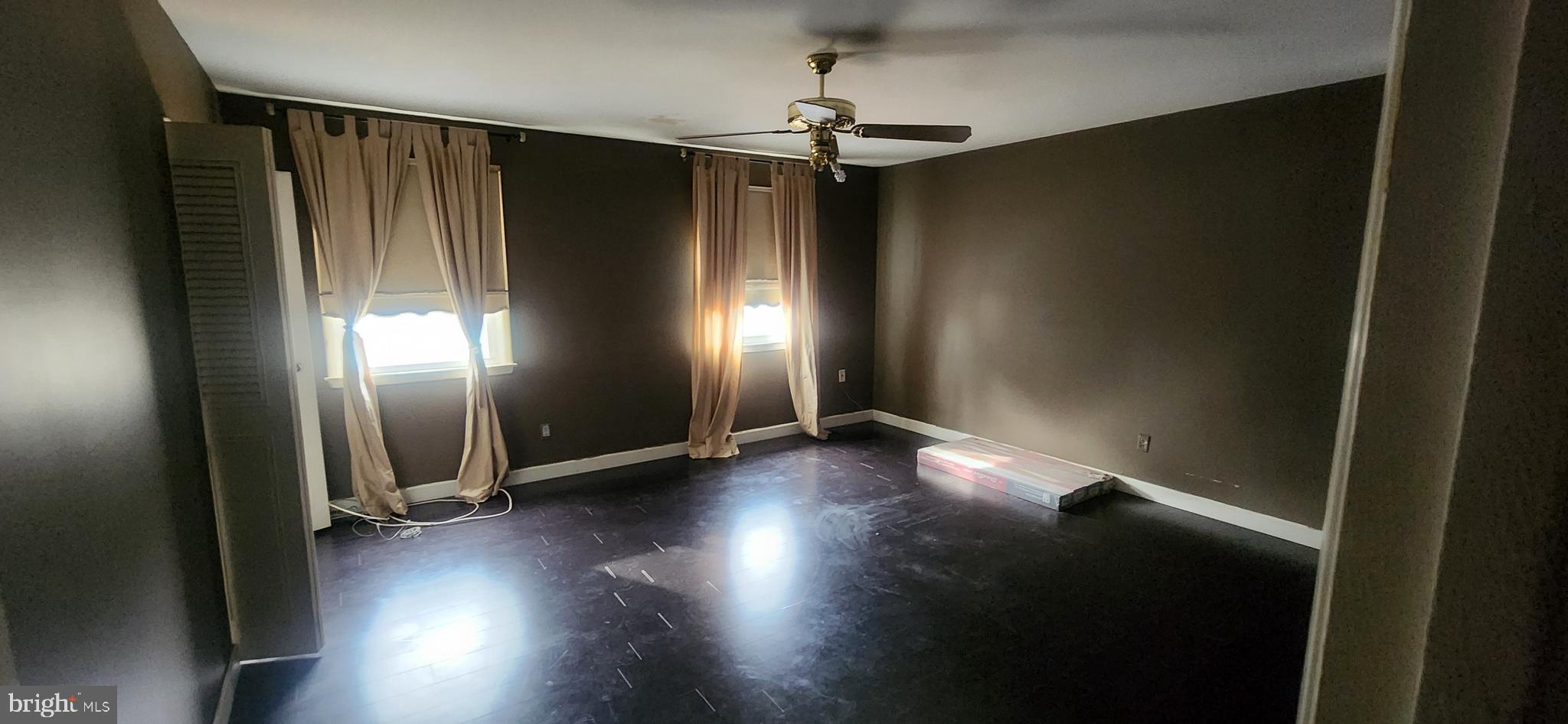 3612 Rockberry Road Baltimore, MD 21234 - Photo 12 of 22 an empty room with wooden floor and windows