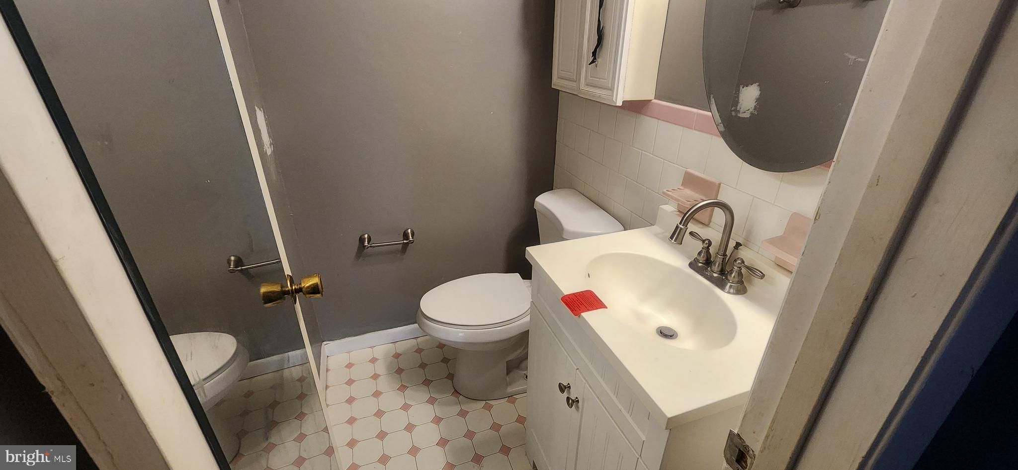 3612 Rockberry Road Baltimore, MD 21234 - Photo 14 of 22 a bathroom with a sink and a toilet
