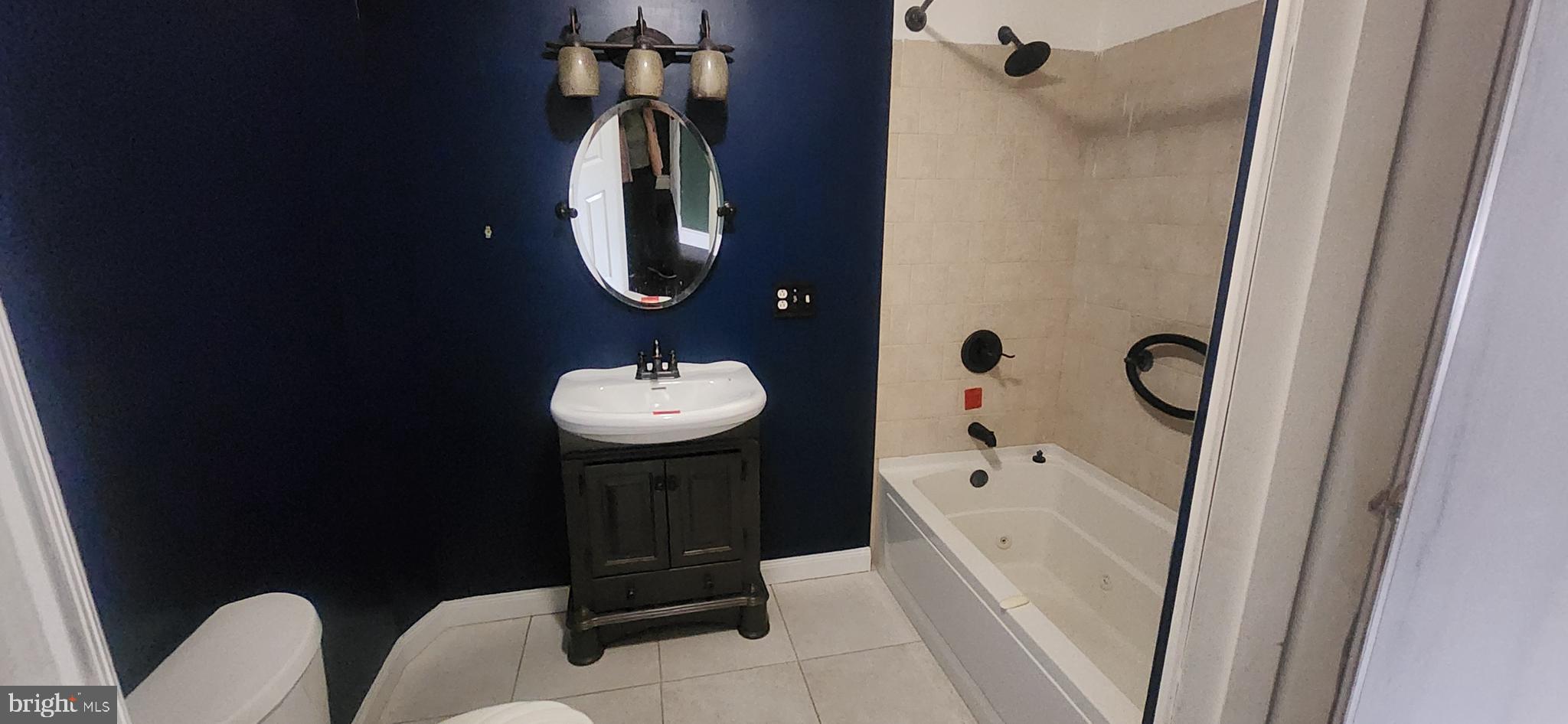 3612 Rockberry Road Baltimore, MD 21234 - Photo 15 of 22 a bathroom with a sink toilet and shower