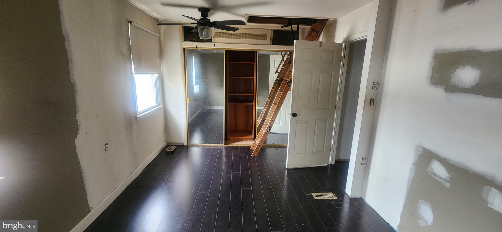 3612 Rockberry Road Baltimore, MD 21234 - Photo 19 of 22 a view of a hallway with wooden floor and staircase