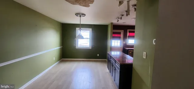 a hall way with furniture