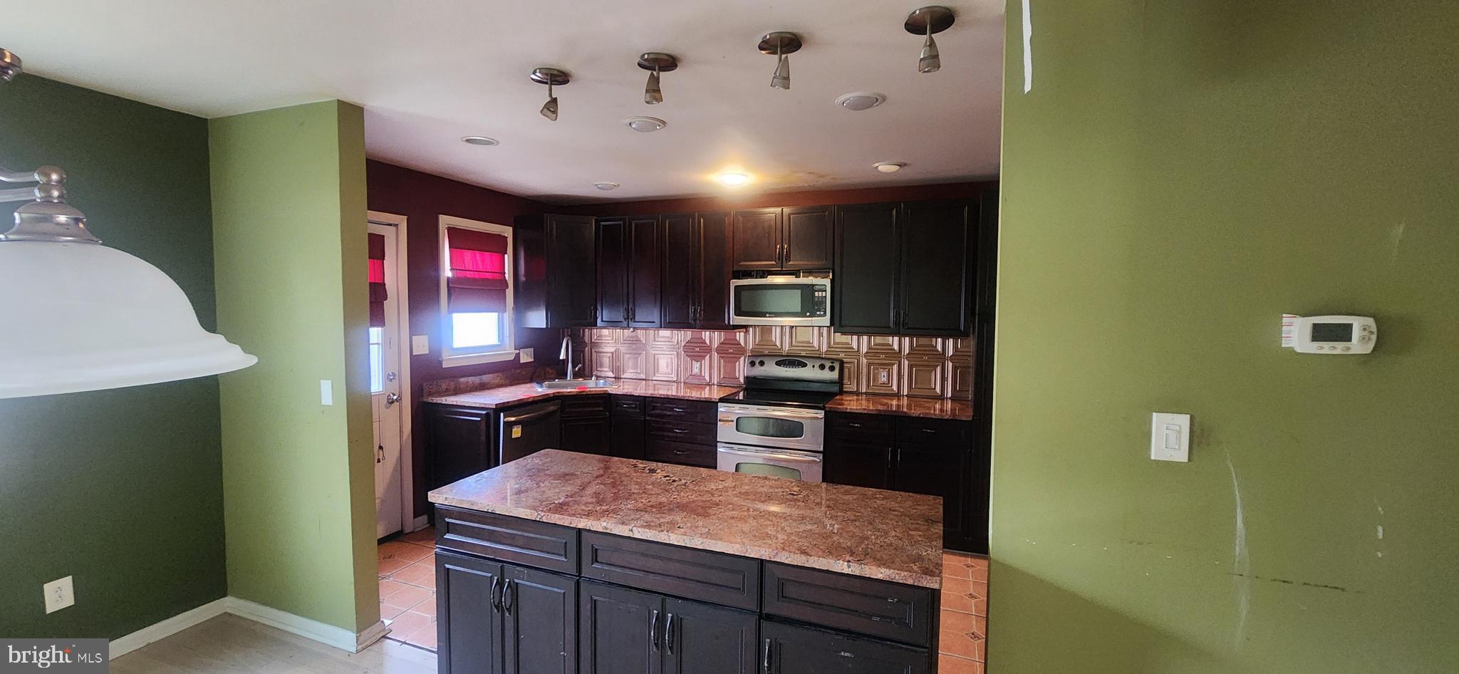 3612 Rockberry Road Baltimore, MD 21234 - Photo 6 of 22 a kitchen with a sink appliances and cabinets