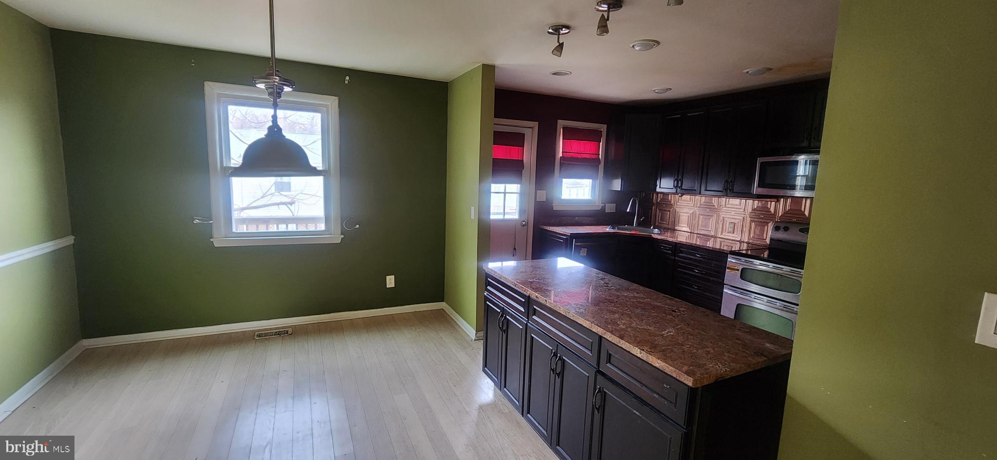 3612 Rockberry Road Baltimore, MD 21234 - Photo 10 of 22 a kitchen with stainless steel appliances granite countertop a stove and a wooden floors