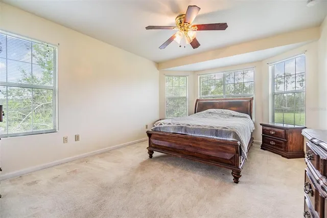 a white toilet sitting next to a bath tub