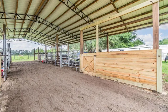 a view of house that has a big yard