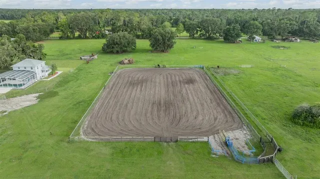 a view of a swimming pool with a yard