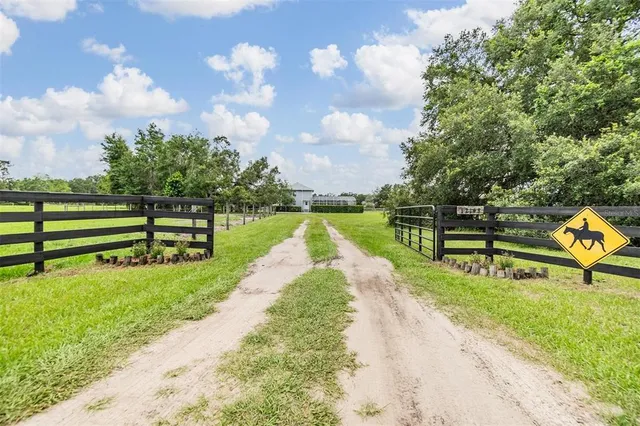 an aerial view of a golf course with chairs