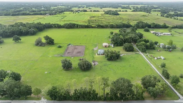 a view of a garden with a building in the background