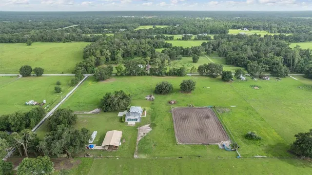a view of a golf course with a big yard