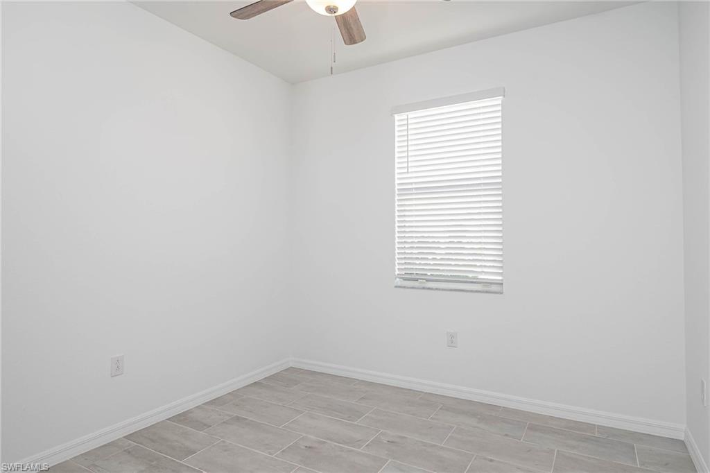 2418 Orchard Street Naples, FL 34120 - Photo 19 of 35 Unfurnished room with ceiling fan
