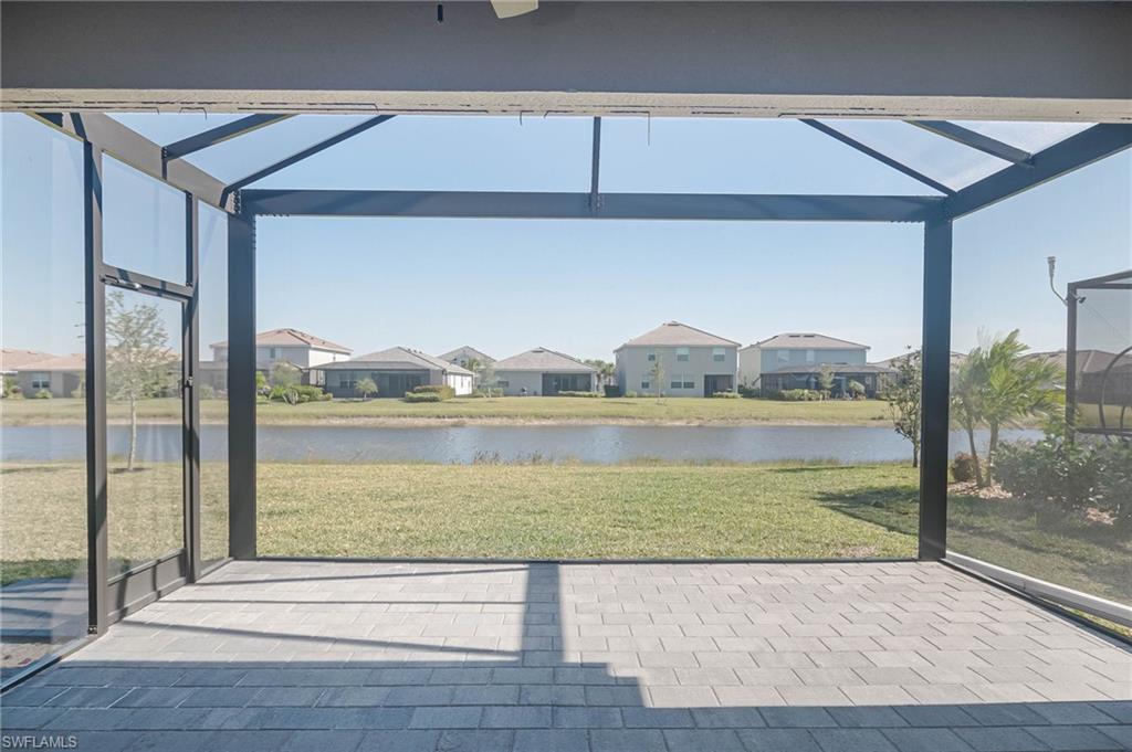2418 Orchard Street Naples, FL 34120 - Photo 26 of 35 Unfurnished sunroom with a water view