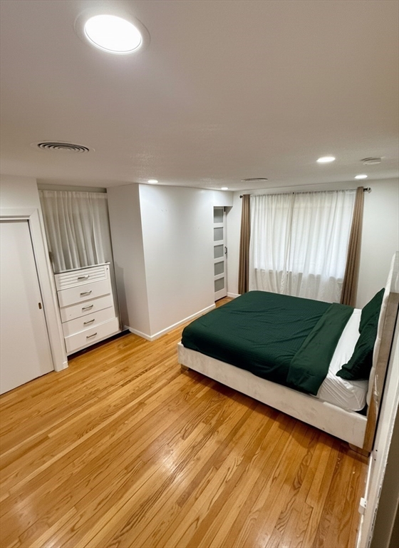 15 Pine Acre Road Springfield, MA 01129 - Photo 12 of 28 a bedroom with a bed and wooden floor