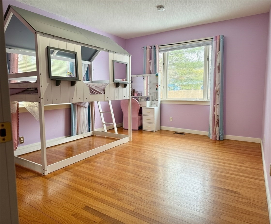 15 Pine Acre Road Springfield, MA 01129 - Photo 18 of 28 a view of an empty room with window and wooden floor