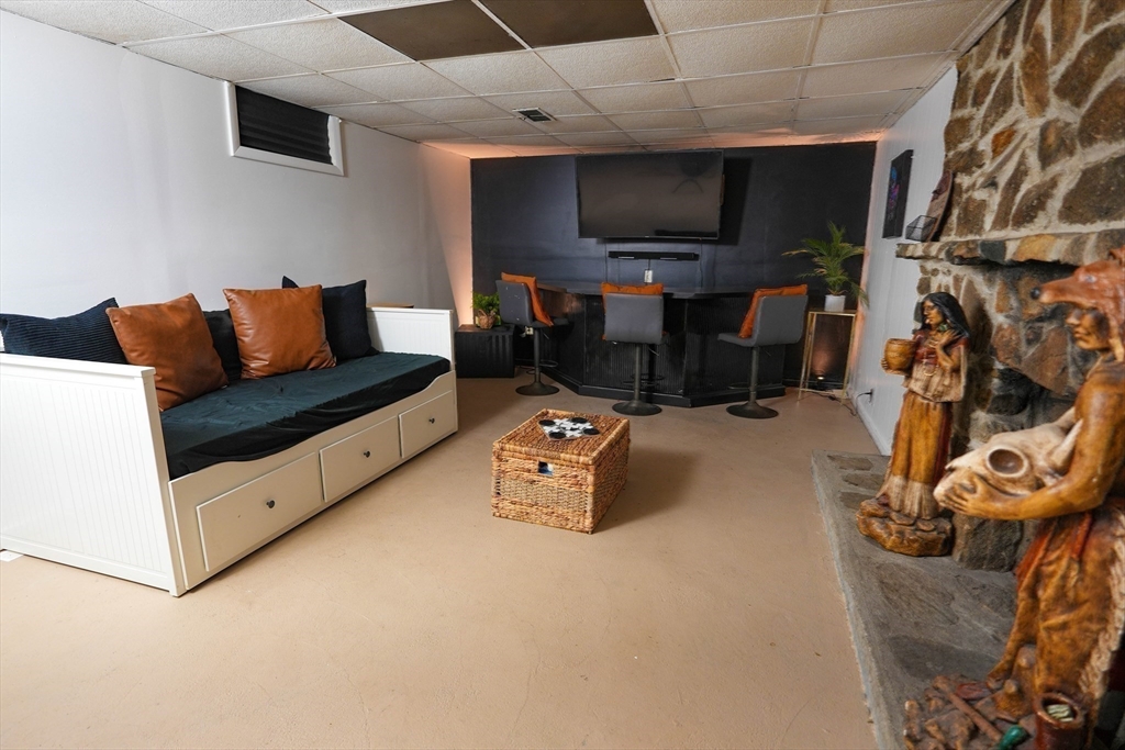 15 Pine Acre Road Springfield, MA 01129 - Photo 23 of 28 a living room with furniture and a flat screen tv