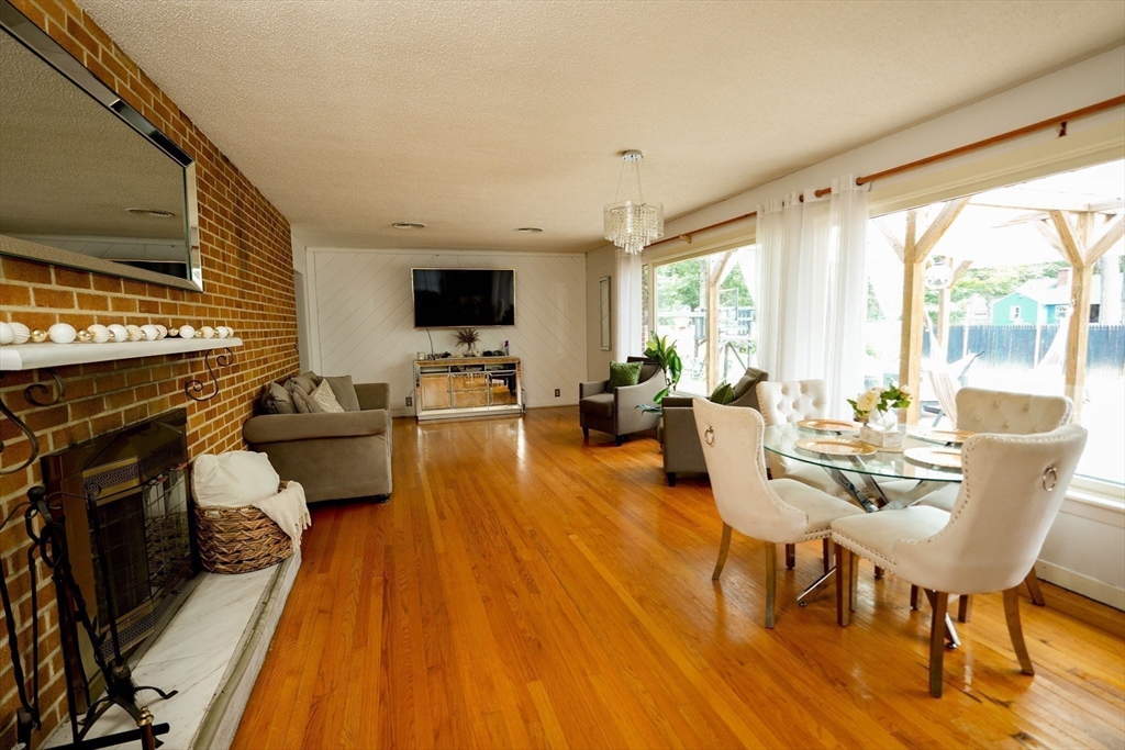 15 Pine Acre Road Springfield, MA 01129 - Photo 6 of 28 a living room with furniture fireplace and a flat screen tv