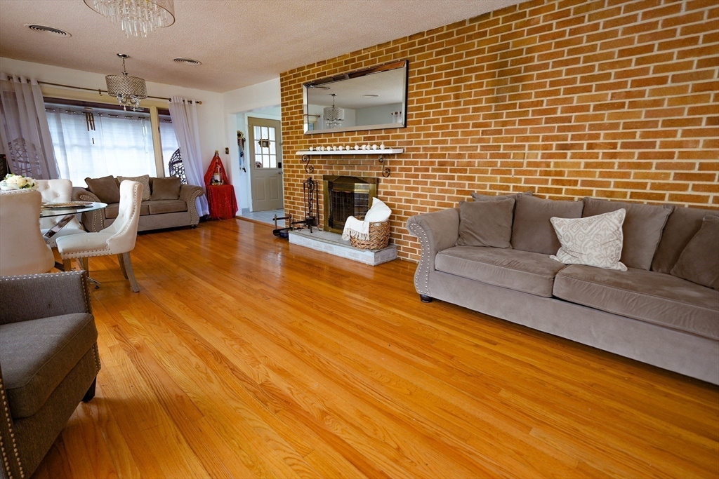 15 Pine Acre Road Springfield, MA 01129 - Photo 7 of 28 a living room with furniture and a fireplace