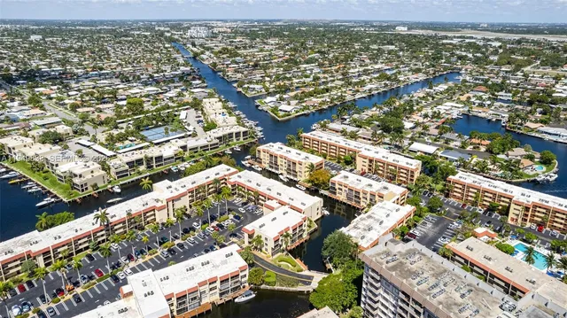 an aerial view of residential houses with city view