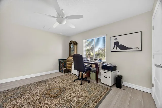 a workspace with wooden floor and a rug