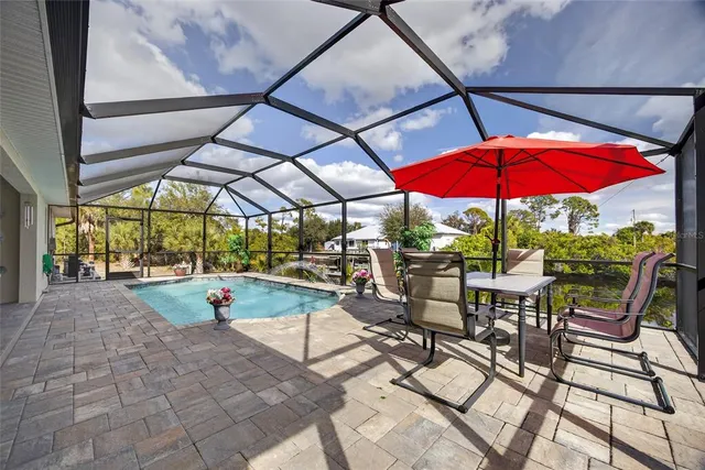 a view of pool with sitting area