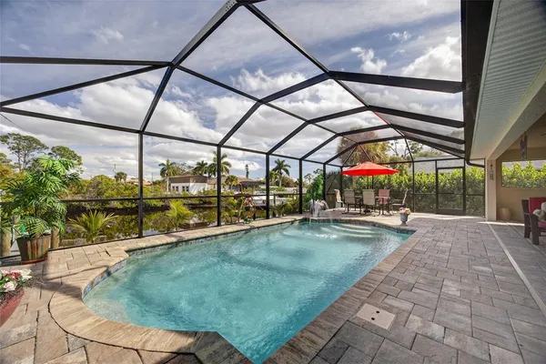a view of a swimming pool with a porch