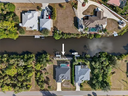 an aerial view of a house with a lake view