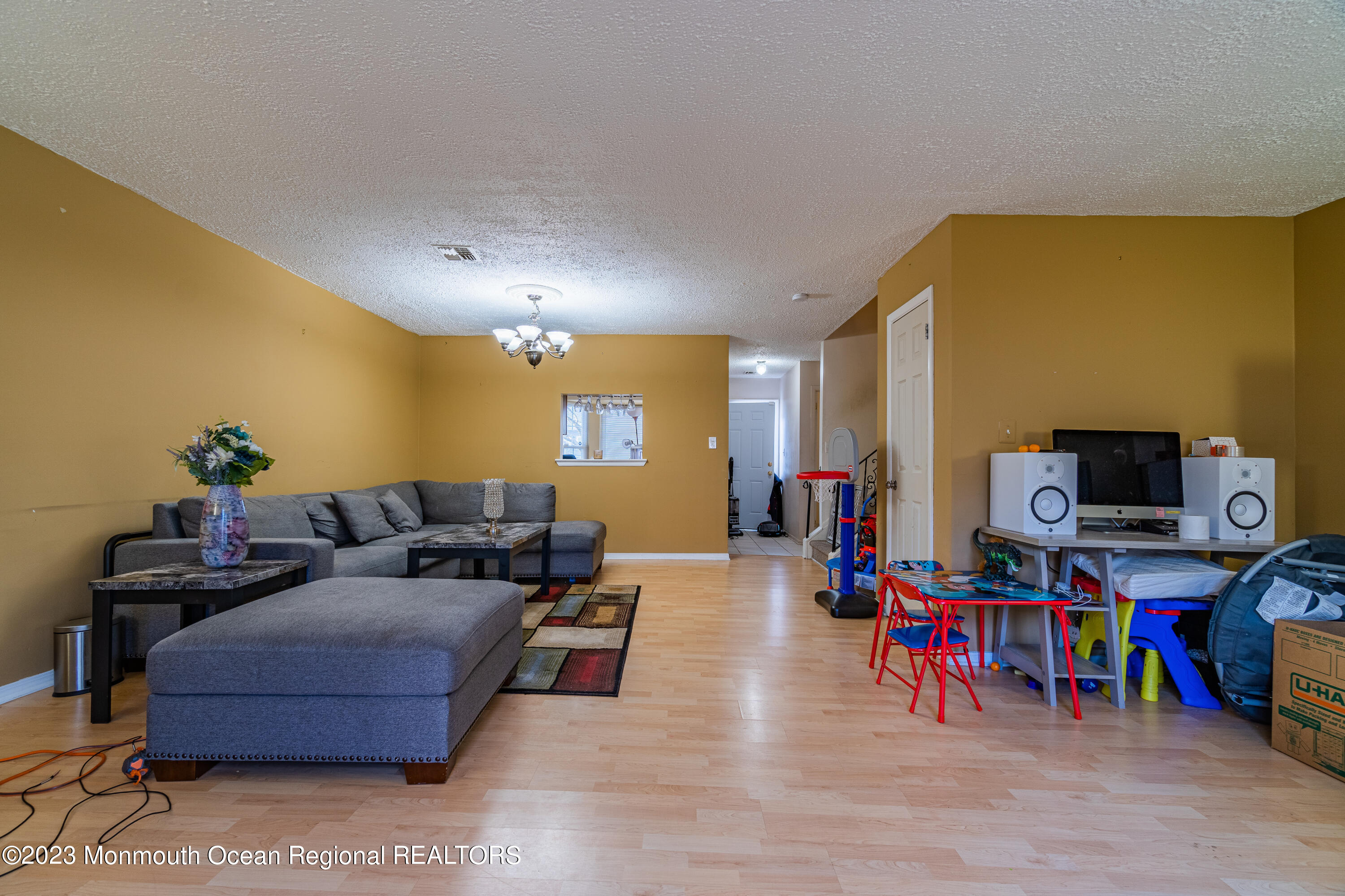 60 County Road, Unit F29 Cliffwood, NJ 07721 - Photo 11 of 26 a living room with furniture and a flat screen tv