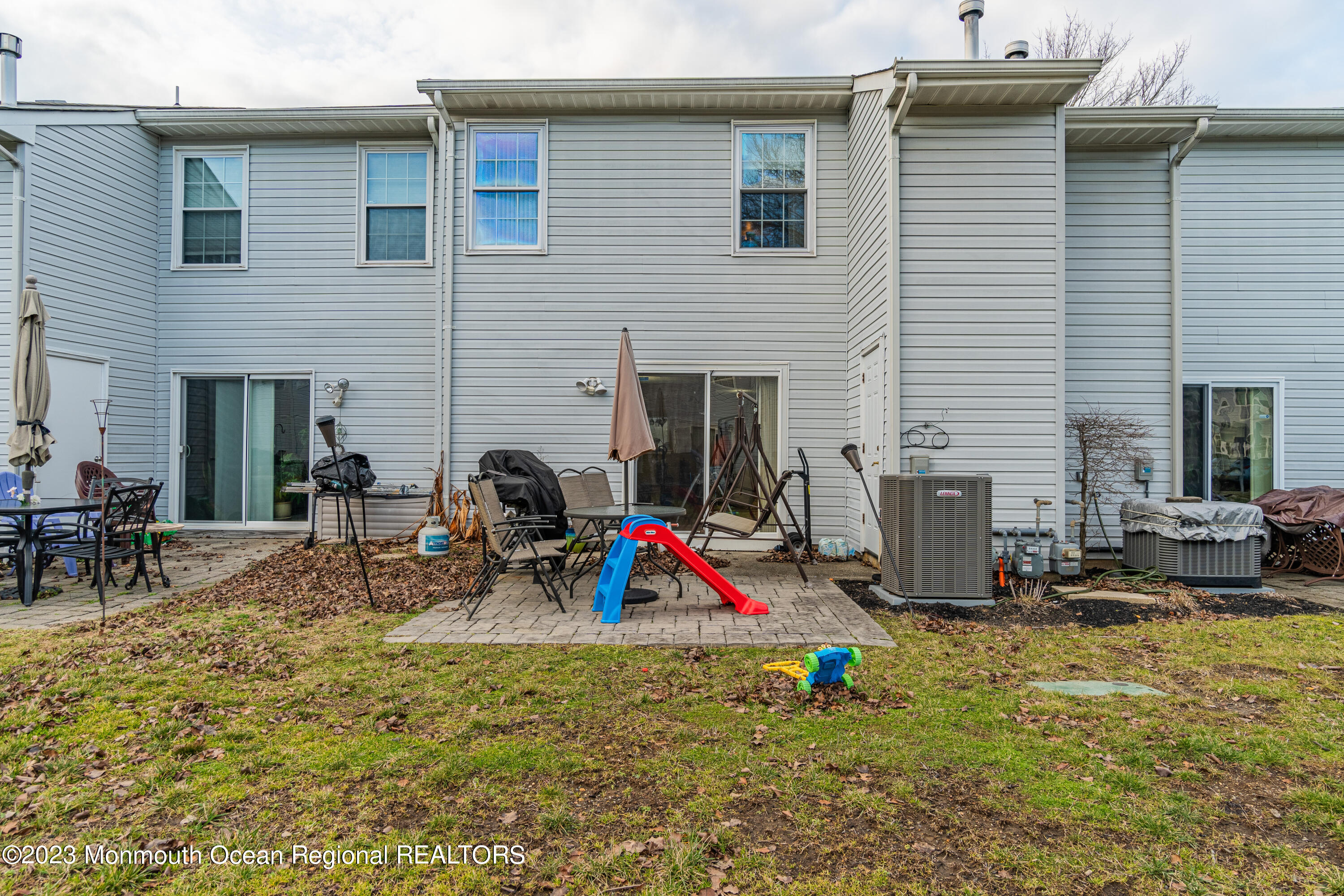 60 County Road, Unit F29 Cliffwood, NJ 07721 - Photo 25 of 26 a view of back yard of the house with outdoor seating