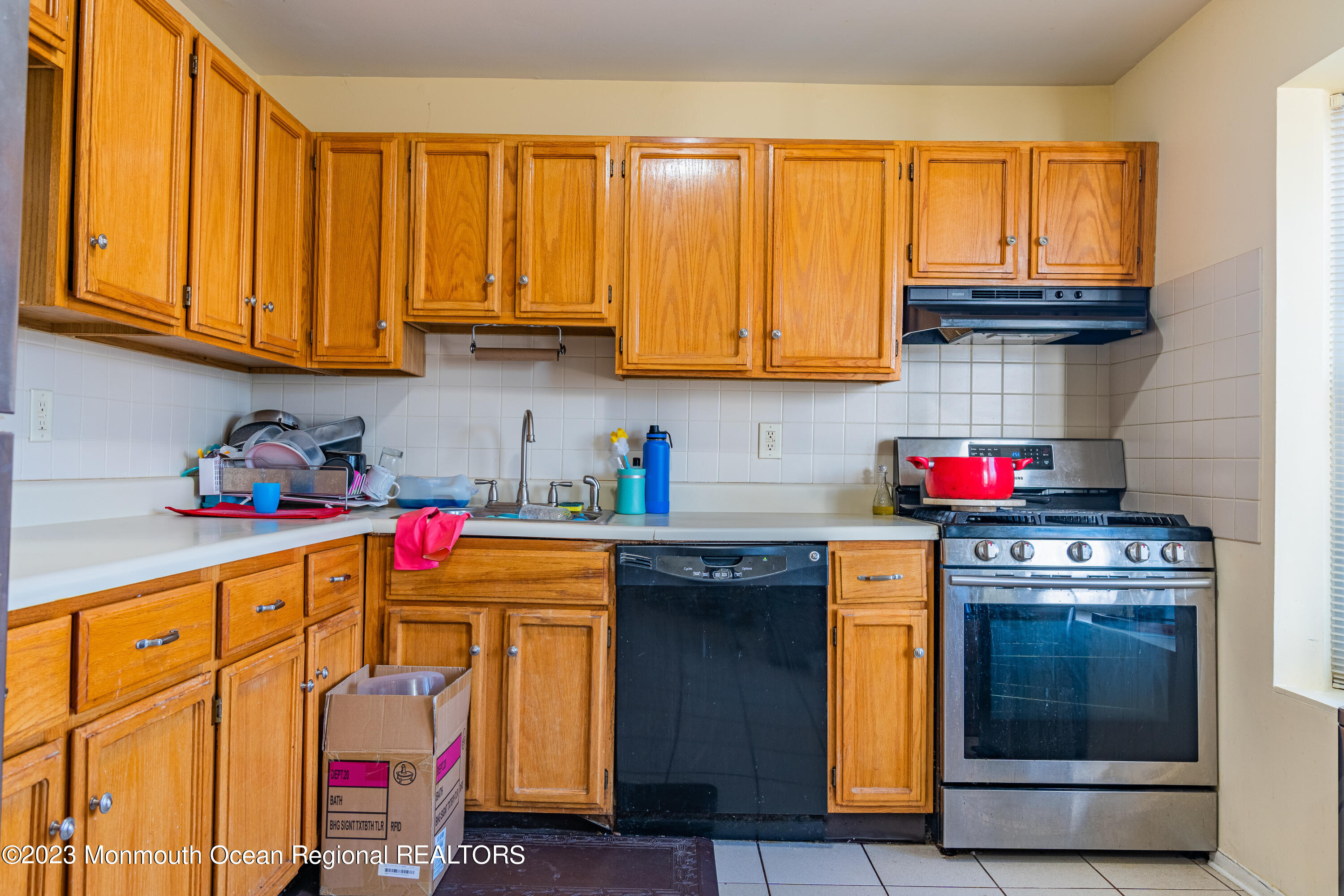 60 County Road, Unit F29 Cliffwood, NJ 07721 - Photo 3 of 26 a kitchen with granite countertop wooden cabinets and a stove top oven