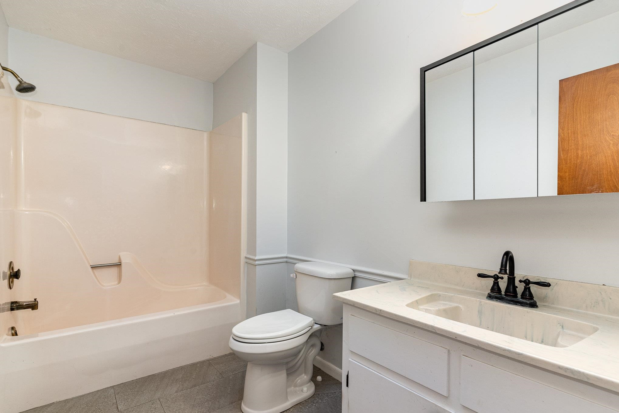 513 Argyll Drive Sanford, NC 27332 - Photo 14 of 31 a bathroom with a sink a toilet and shower