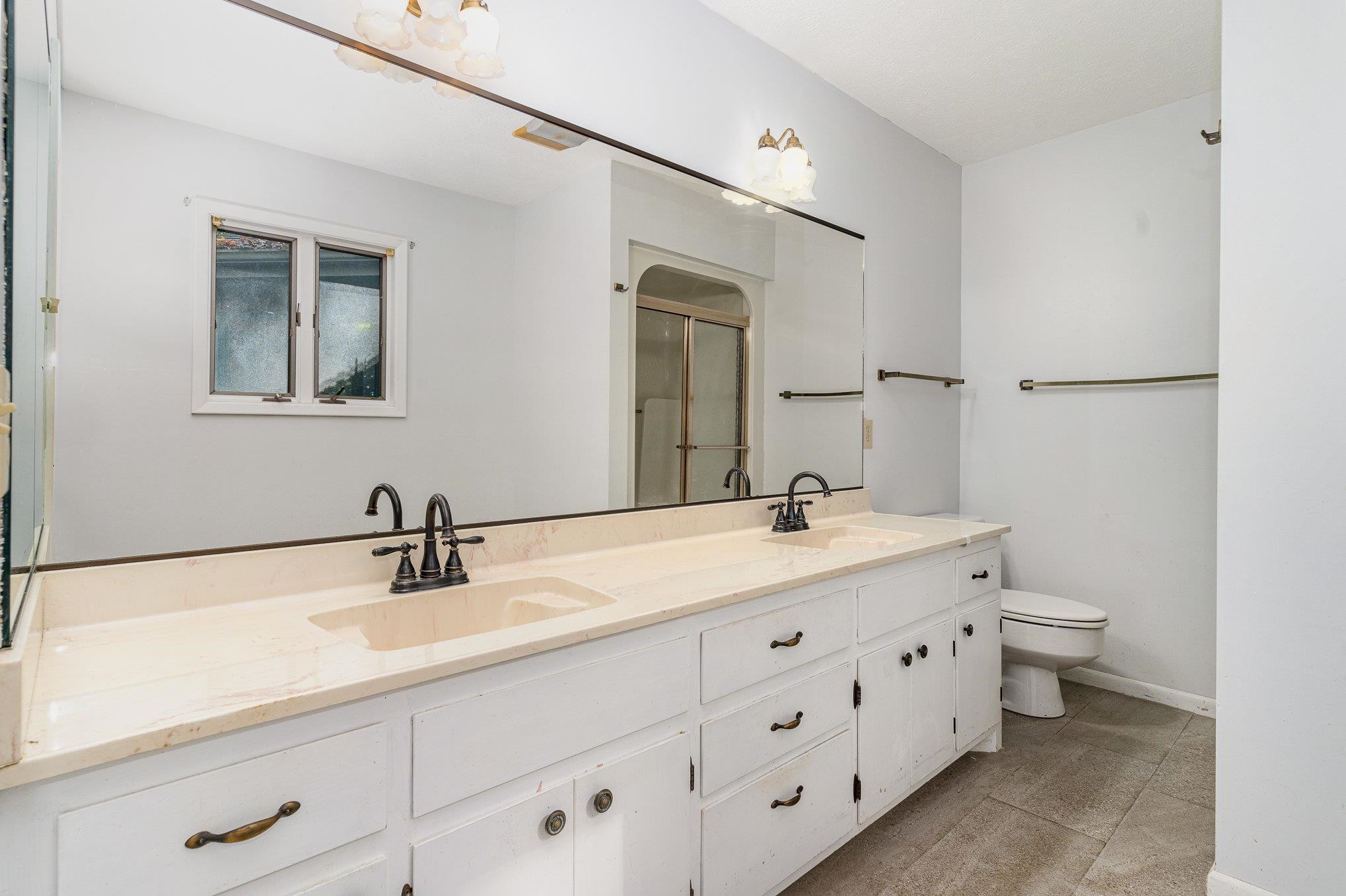 513 Argyll Drive Sanford, NC 27332 - Photo 17 of 31 a bathroom with a double vanity sink and mirror