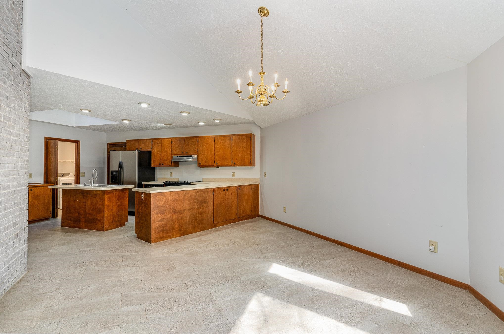 513 Argyll Drive Sanford, NC 27332 - Photo 7 of 31 a view of kitchen with granite countertop cabinets and refrigerator